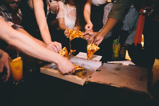 People sharing pizza